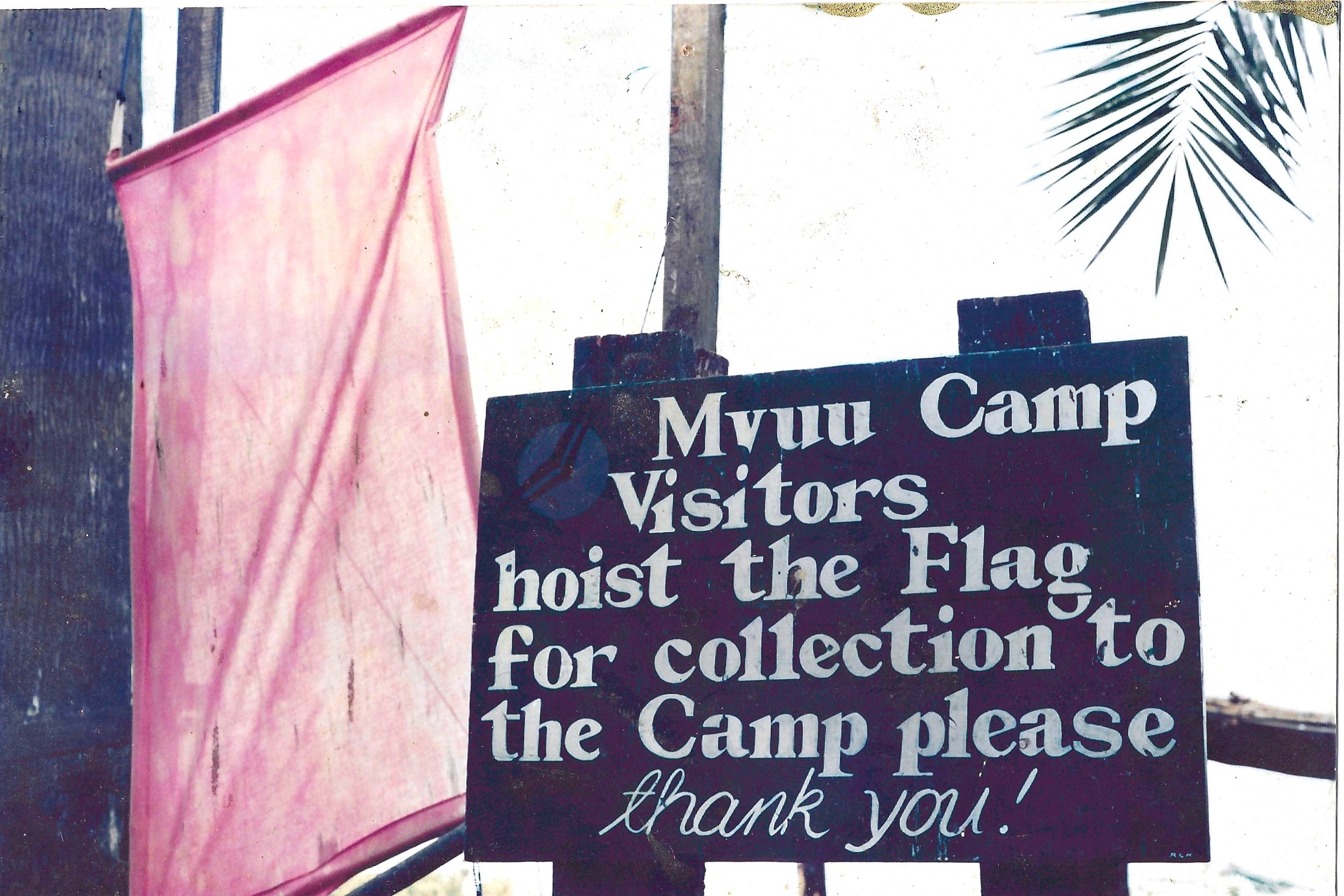 The old arrival sign at Charlie Charlie, our boat pickup point. Guests previously had to hoist the flag for collection.