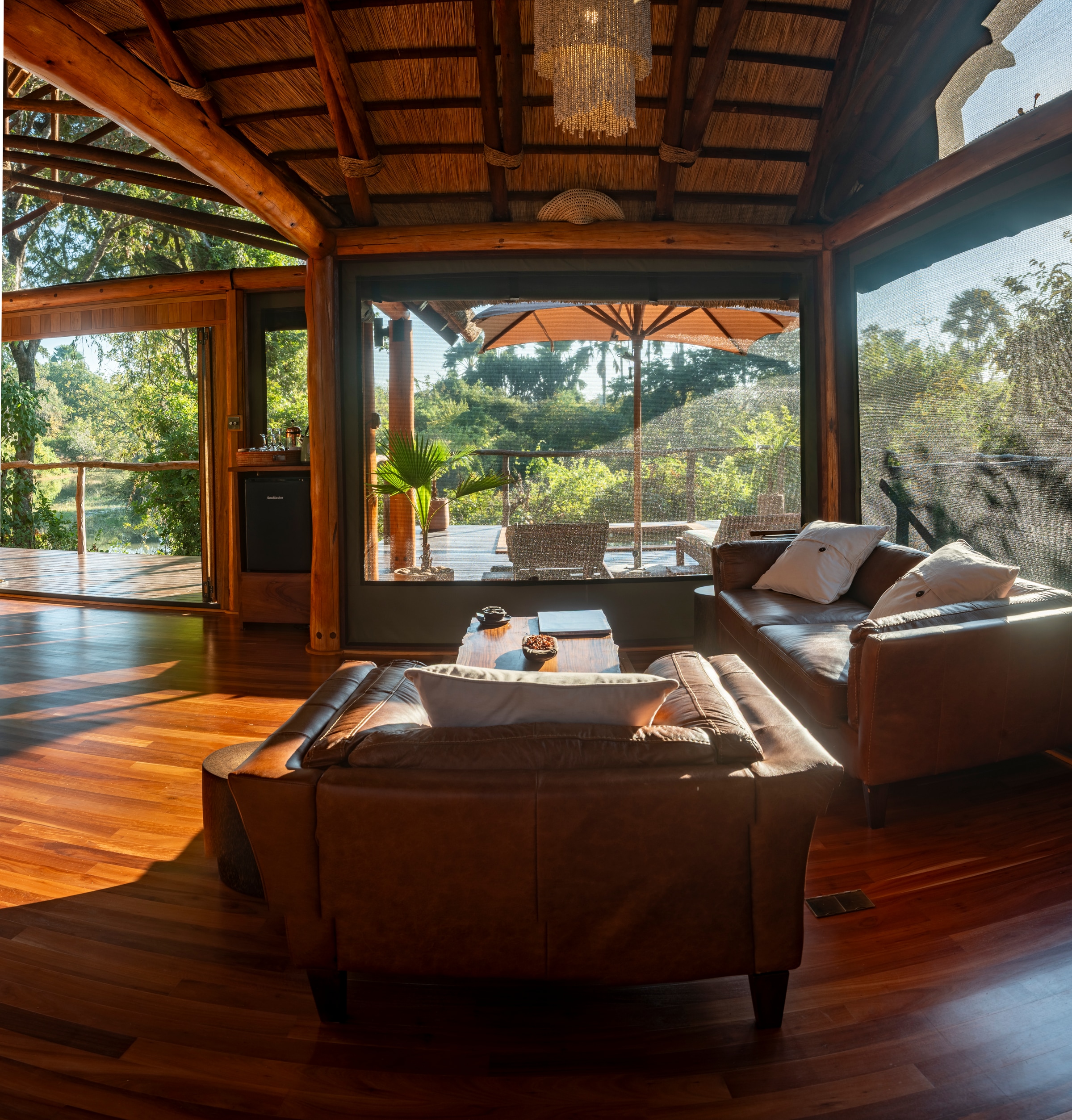 Kuwala's private lounge opening towards the deck and lagoon.