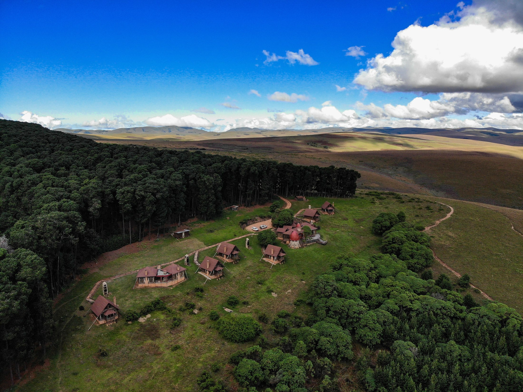 Chelinda Lodge with the Nyika Plateau stretching behind it.
