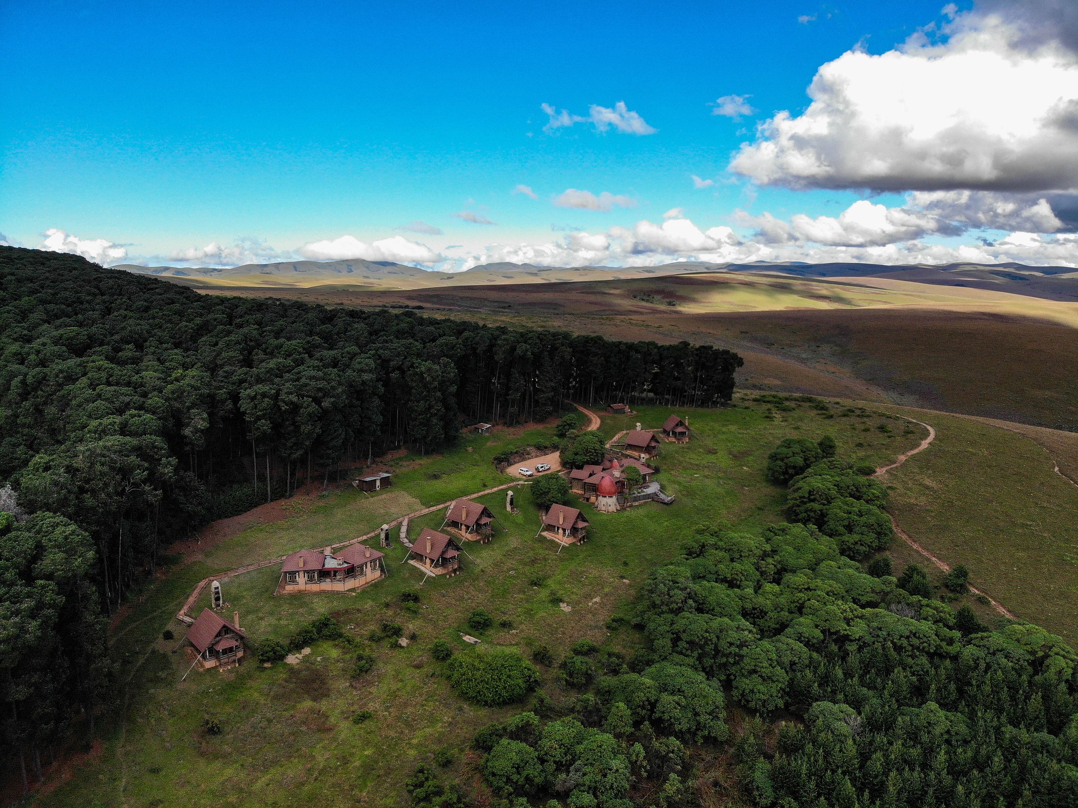 Chelinda Lodge with the Nyika Plateau stretching behind it.