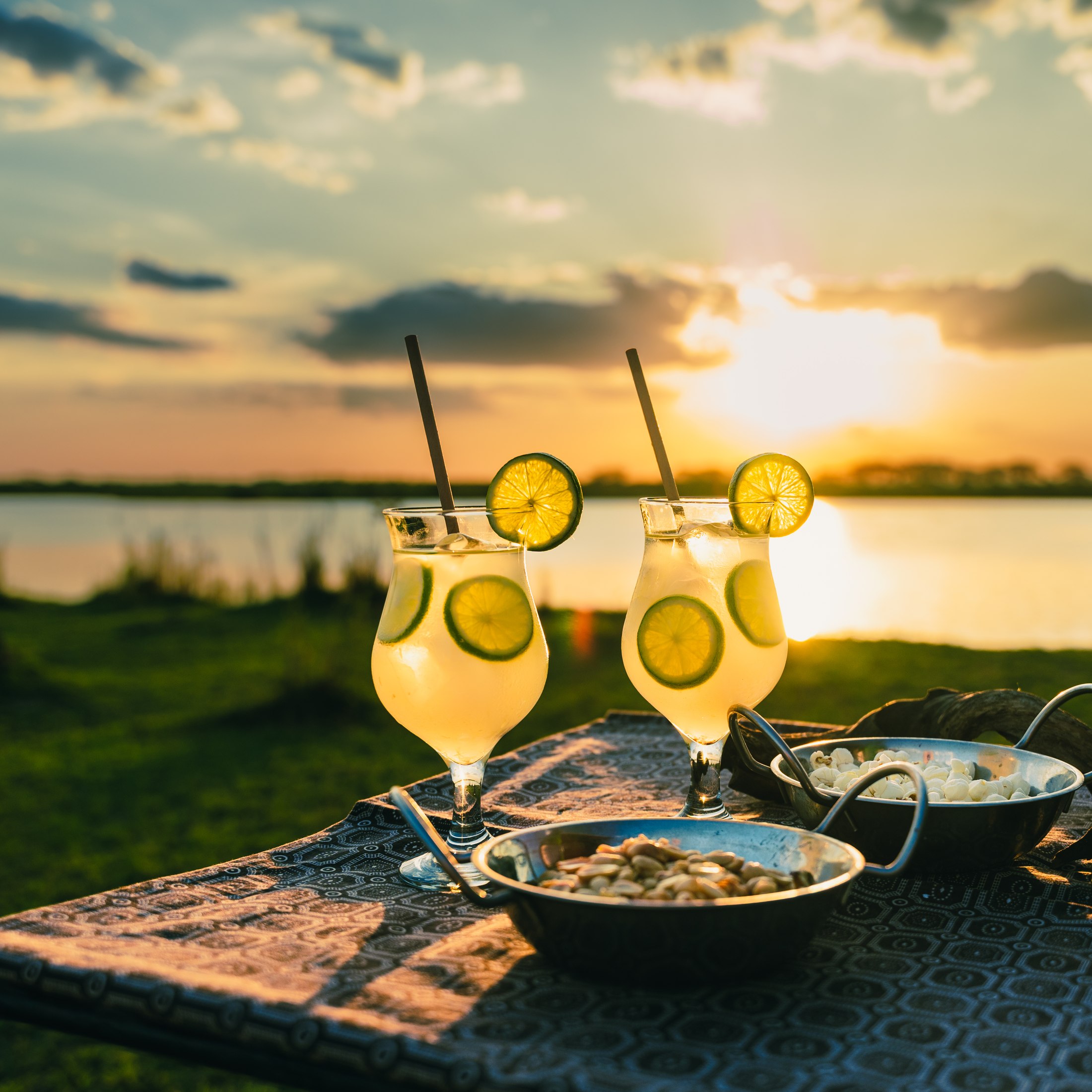 Two sundowner drinks beside the river.