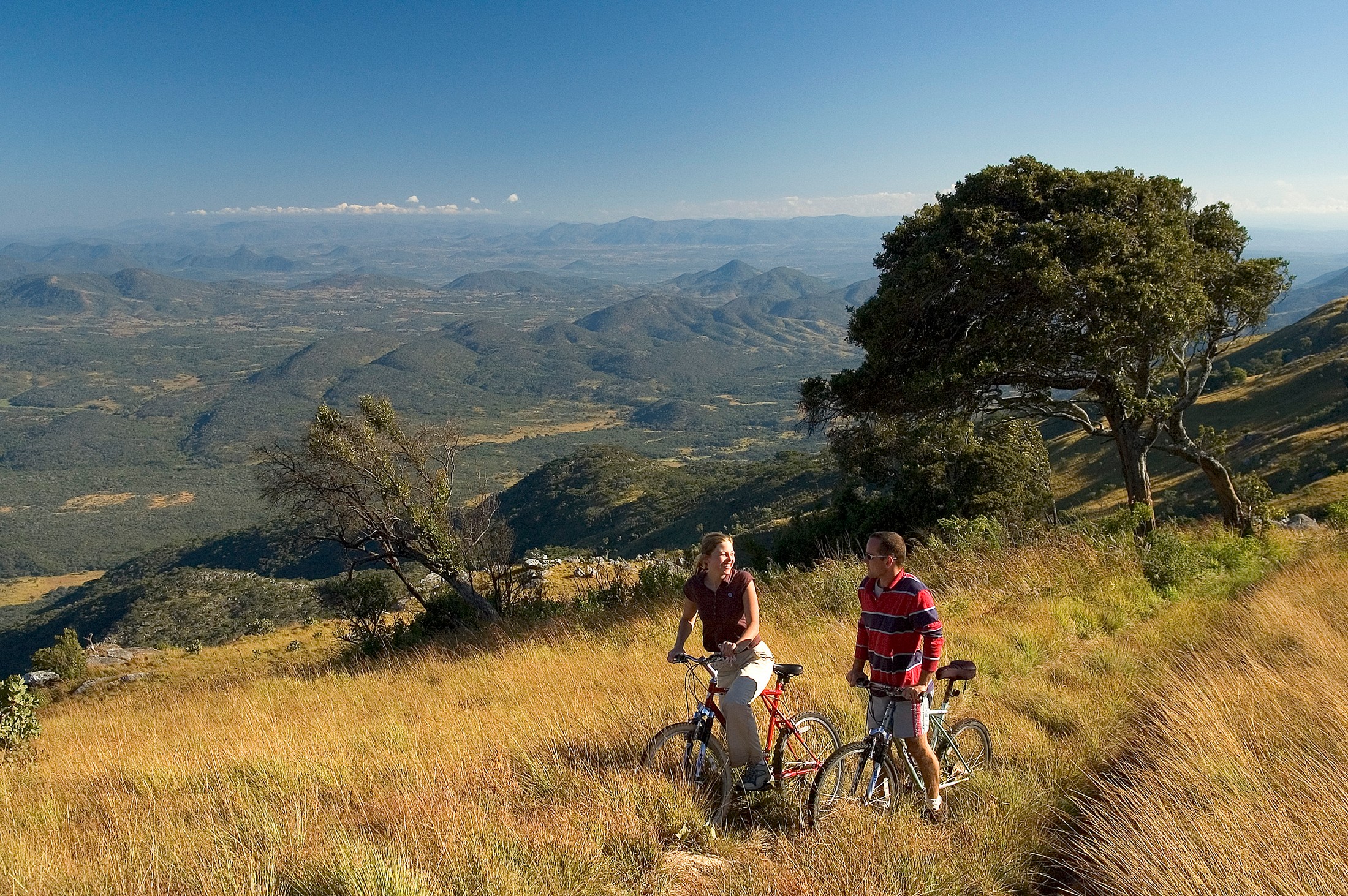 Cycling through Nyika’s highland grasslands · Dana Allen.